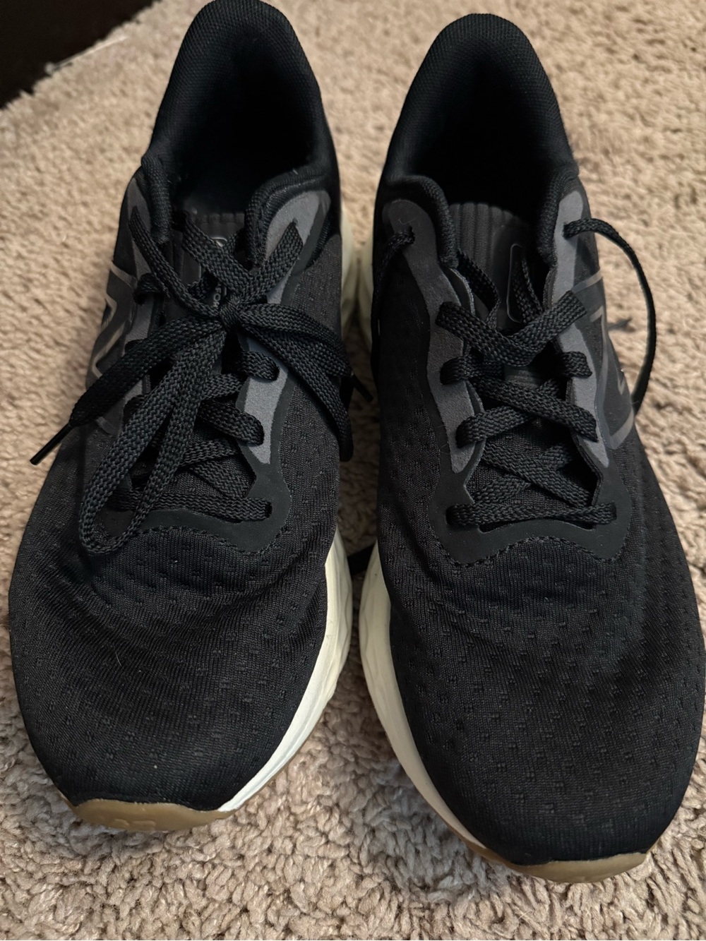 New Balance Black Athletic Running Shoes with White Sole